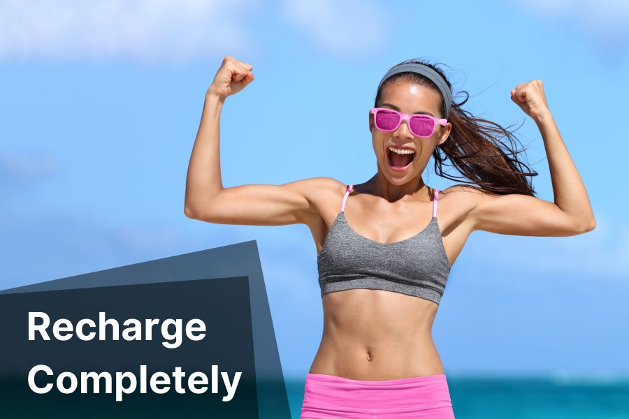 Woman flexing her muscles and smiling with caption Recharge Completely